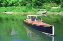 A Bolger 24 foot character runabout "Sneakeasy" built by Steve Bosquette of Portland Maine. This owner and boat have committed to attend.